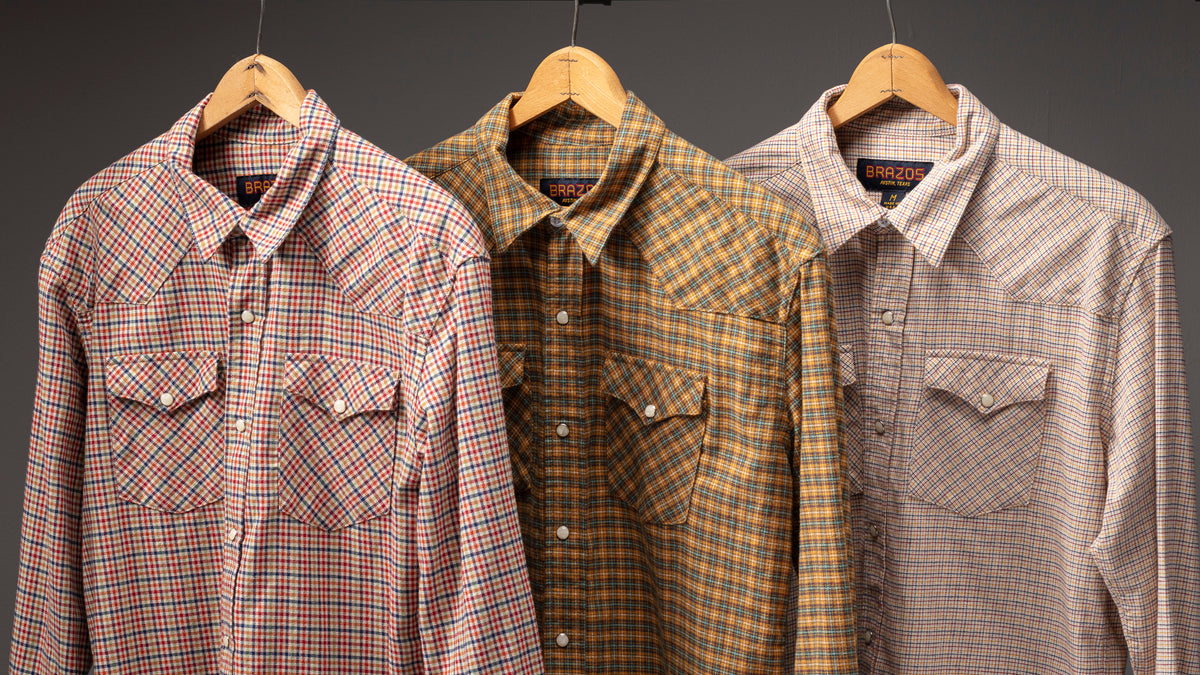 Shady Grove, Blanco and Golden Hobo micro-check flannel western shirts hanging on a rack